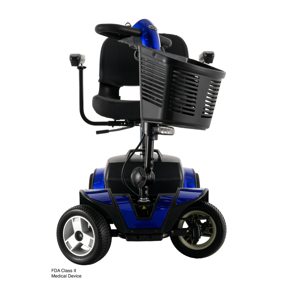The Pride Go Go® Sport 4-Wheel Scooter, in blue with a large front basket, black seat, armrests, and four wheels, is shown from the front on a white background. “FDA Class II Medical Device” appears in Inter font at the lower-left corner.