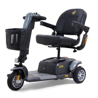 The Golden Buzzaround LX GB119 is a heavy-duty, three-wheel portable mobility scooter that combines luxury with convenience. It features a padded seat, armrests, a front basket, and handlebars to enhance ease of use and accessibility.