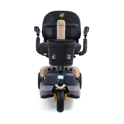 The Golden Buzzaround LX GB119 is a high-end mobility scooter in beige, equipped with a black seat and armrests. This portable three-wheel scooter comes with a bottom headlight and includes a handy basket positioned behind the seat.