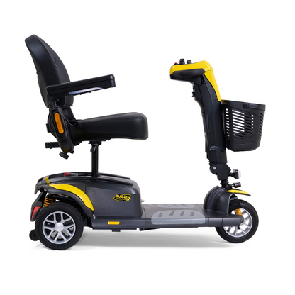 Side view of a black and yellow Golden Buzzaround LX GB119 luxury mobility scooter, featuring a padded seat, backrest, and armrests. This heavy-duty three-wheel model from Golden Technologies comes equipped with a front storage basket for convenience, making it an ideal portable mobility option.