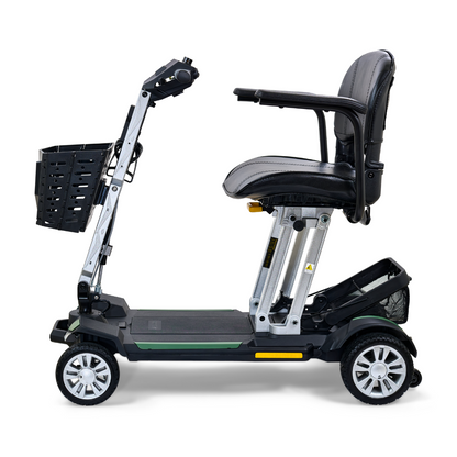 The Golden Technologies Portable Buzzaround GB120 Carry-On Travel Scooter is a sleek, black mobility scooter equipped with a cushioned seat, armrests, and a front basket. This ultra-portable model boasts four wheels and a fold-flat design for convenient transport, powered by a reliable lithium-ion battery.