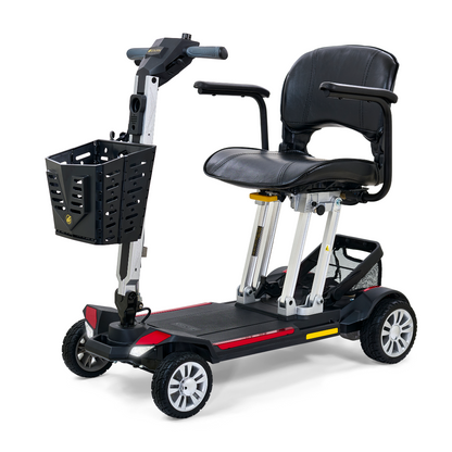 The Golden Technologies Portable Buzzaround GB120 Carry-On Travel Scooter is a compact, ultra-portable mobility solution featuring a black seat with armrests, a steering handle, and a front basket. Its sleek design includes four wheels with red detailing accents, and the fold-flat scooter is powered by a lithium-ion battery for ultimate convenience.