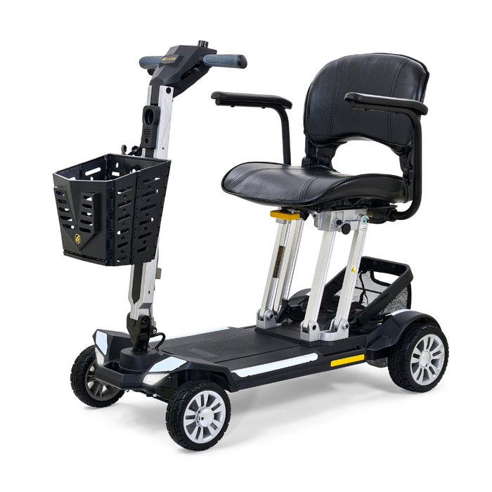 Introducing the Golden Technologies Portable Buzzaround GB120 Carry-On Travel Scooter, a compact and ultra-portable mobility solution featuring a black seat, lithium-ion battery, and four wheels. The scooter is equipped with a front basket and boasts a silver frame with black accents. For enhanced comfort, it includes adjustable armrests and handlebars.