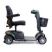 Here's a revised version of the sentence using the provided product data:

A side view of the Golden Buzzaround LX GB149, a heavy-duty, four-wheel portable mobility scooter, showcases its cushioned seat, armrests, and front basket. This travel-friendly scooter features a sleek design with an adjustable tiller and distinctive green accents on its chassis.