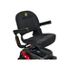 The Golden Buzzaround LX GB149 features a black cushioned seat with armrests, a backrest adorned with a quilted pattern and logo on the upper back. This seat is mounted on the scooter's red base and the design prioritizes convenience, making it an ideal portable travel scooter.