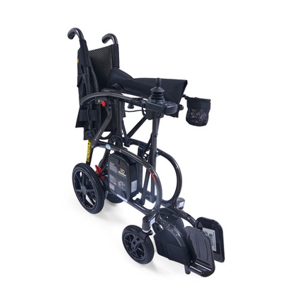 The Golden Cricket™ LT Carbon Portable Lightweight Powerchair, weighing only 25 lbs, features joystick control on the armrest, a sleek black frame, footrests, large rear wheels, and a mesh side pocket. Photographed on a white background.
