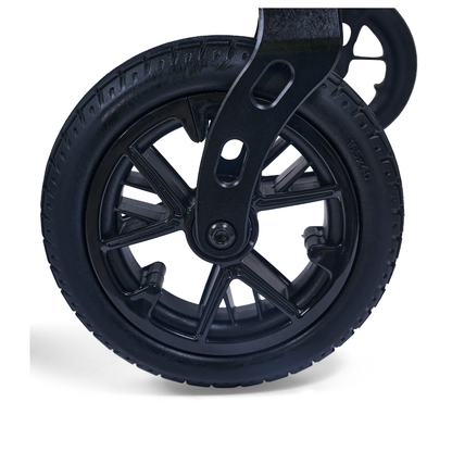 Close-up of a black rubber wheel with spokes, attached to the Golden Cricket™ LT Carbon Portable Lightweight Powerchair (only 25 lbs), highlighting its smooth mobility and maneuverability against a white background.