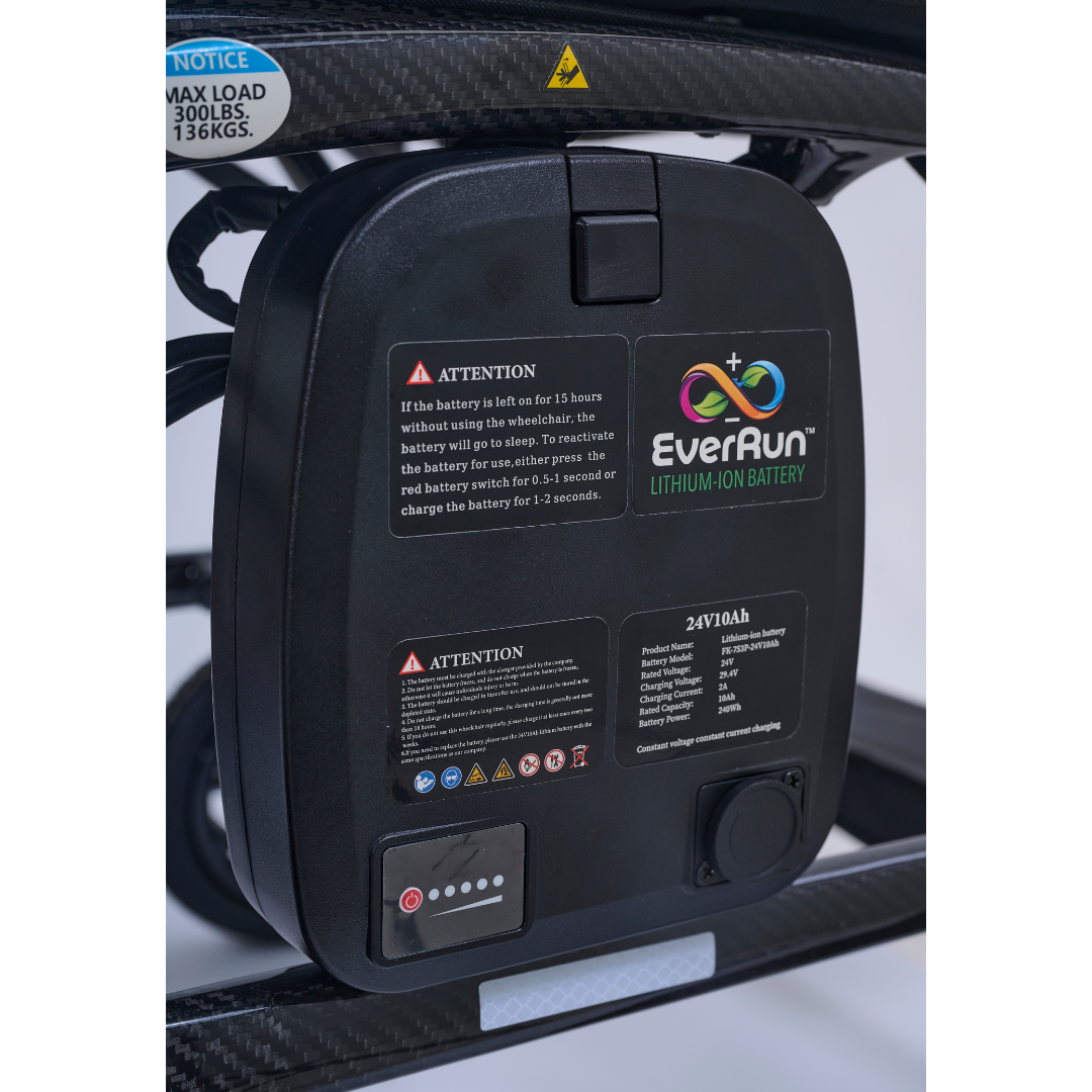 Close-up of an EverRun lithium-ion battery pack on a device frame, showing warning labels, battery info, and LED. Inspired by the Golden Cricket™ LT Carbon Portable Lightweight Powerchair—just 25 lbs—for outstanding freedom and strength.