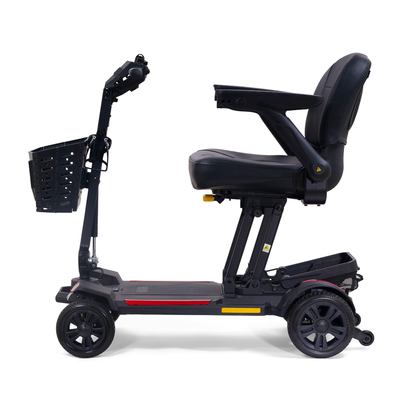 A side view of the Golden Buzzaround GB220 CarryOn HD Travel Scooter, a black, lightweight four-wheel mobility scooter with padded seat, armrests, front basket, and 400 lb weight capacity for personal transportation and accessibility.