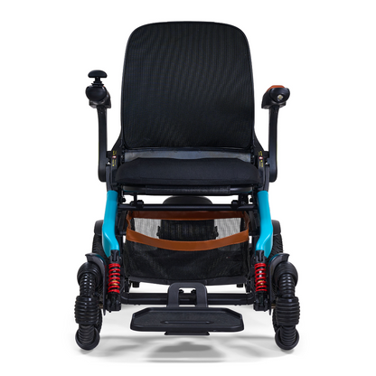 The Golden Tech Ally Pro Smart All-Terrain Power Wheelchair features omni-directional wheels, a black seat and backrest, teal frame accents, red suspension springs, a joystick on the right armrest, and a footrest at the bottom.