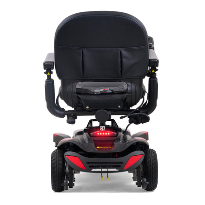 Rear view of the Golden Tech BuzzAbout Portable Power Wheelchair in black, featuring four wheels, padded seat and backrest, armrests, and rear red reflector lights—perfect for comfort and mobility in a compact power chair.