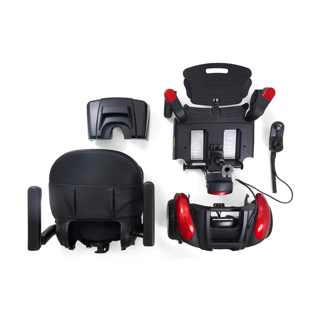 Four key parts of a disassembled Golden Tech BuzzAbout Portable Power Wheelchair in black and red are arranged on a white background: the seat, backrest, wheeled base, and control panel.