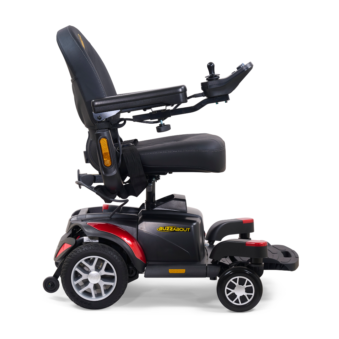 A side view of a black and red Golden Tech BuzzAbout Portable Power Wheelchair with four wheels, padded seat, armrests, joystick controls, and "BuzzAbout" visible on the base.