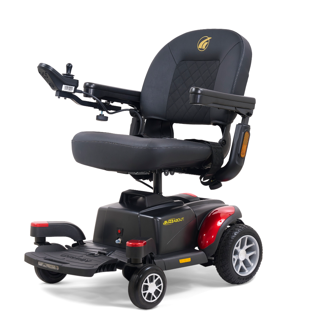 The Golden Tech BuzzAbout Portable Power Wheelchair is black and red with armrests, a cushioned seat, control joystick, and four wheels, designed for mobility assistance.