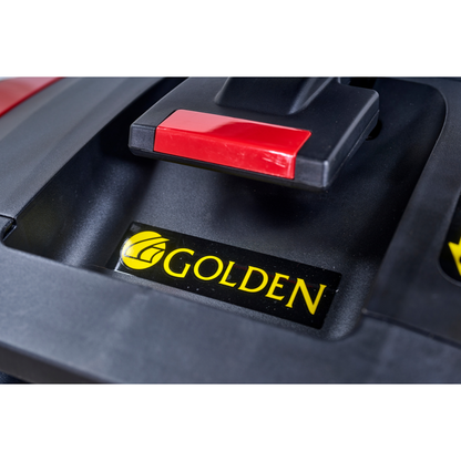 Close-up of a black surface with a red handle and yellow GOLDEN logo with leaf, highlighting the branding of the Golden Tech Buzzaround GB152 XL+ 4-Wheel Mobility Scooter and part of its surrounding structure.