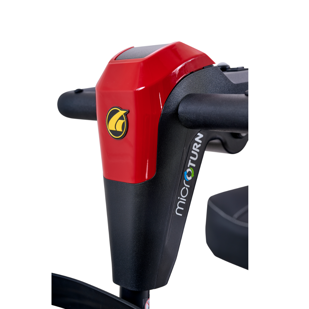 Close-up of a black and red control panel on a Golden Tech Buzzaround GB152 XL+ 4-Wheel Mobility Scooter, featuring a yellow logo and the word "microTURN" in white and blue on the side.