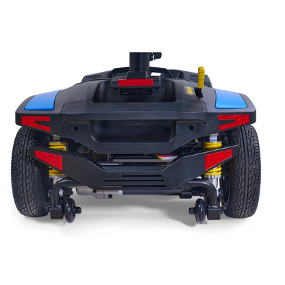 Rear view of a Golden Tech Buzzaround GB152 XL+ 4-Wheel Mobility Scooter base with large wheels, red reflectors, black bumper, suspension springs, and a yellow lever on the right side.