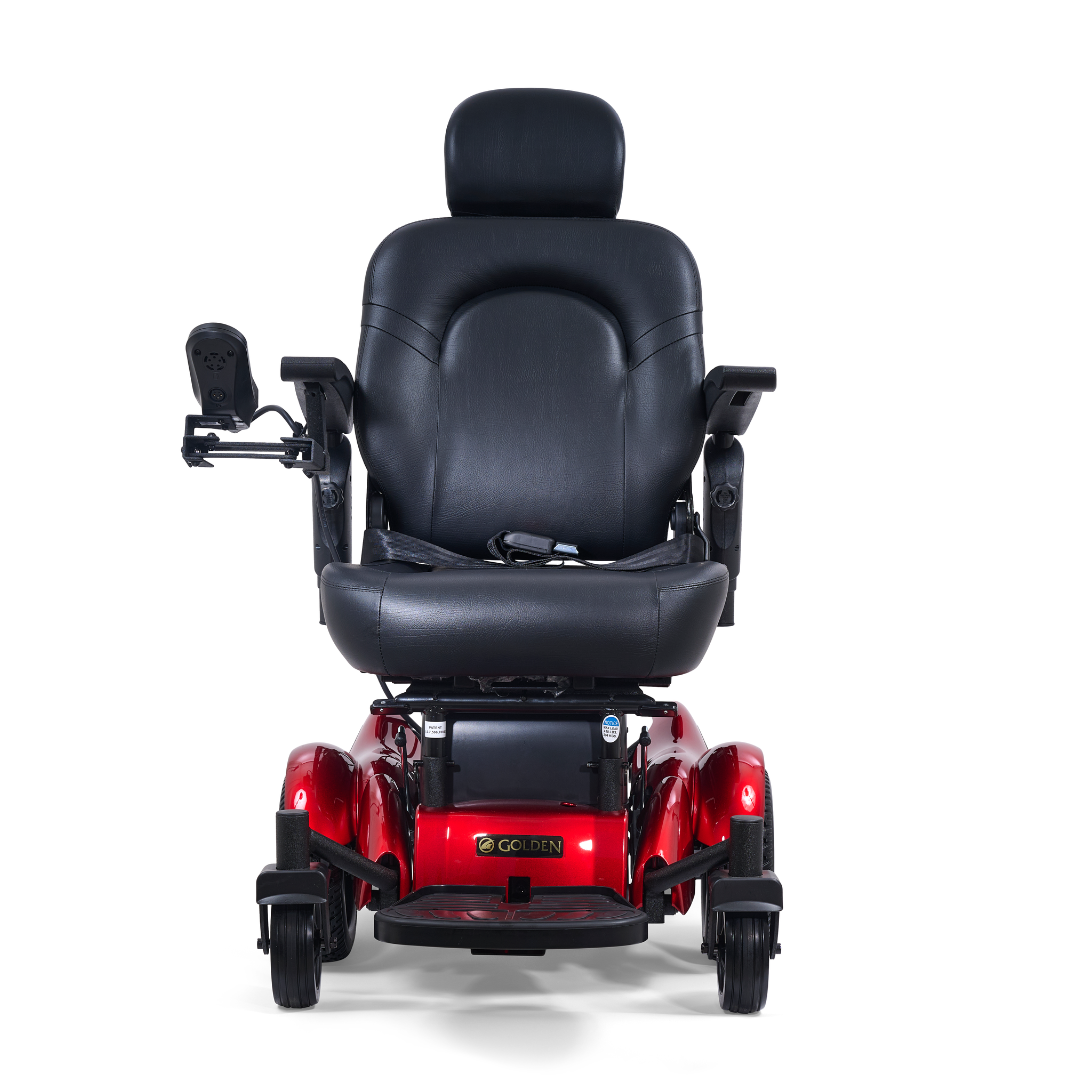 A Golden Tech GP620 Compass HD Bariatric Electric Wheelchair in red, featuring a black cushioned seat, headrest, armrests, and left-side control panel; front view with four wheels against a white background.