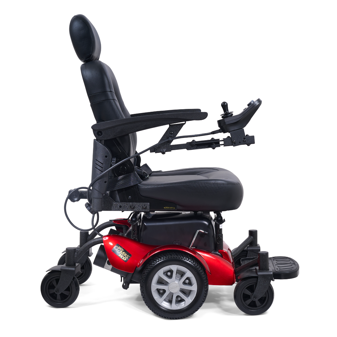 A red and black Golden Tech GP620 Compass HD Bariatric Electric Wheelchair with high backrest, headrest, padded seat, armrests, joystick control, and four wheels is shown from the side against a white background.