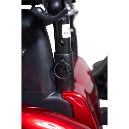 Close-up of a black metal seat post with locking pin on a shiny red Golden Tech GP620 Compass HD Bariatric Electric Wheelchair, surrounded by curved red and black surfaces and featuring a white-labeled post.