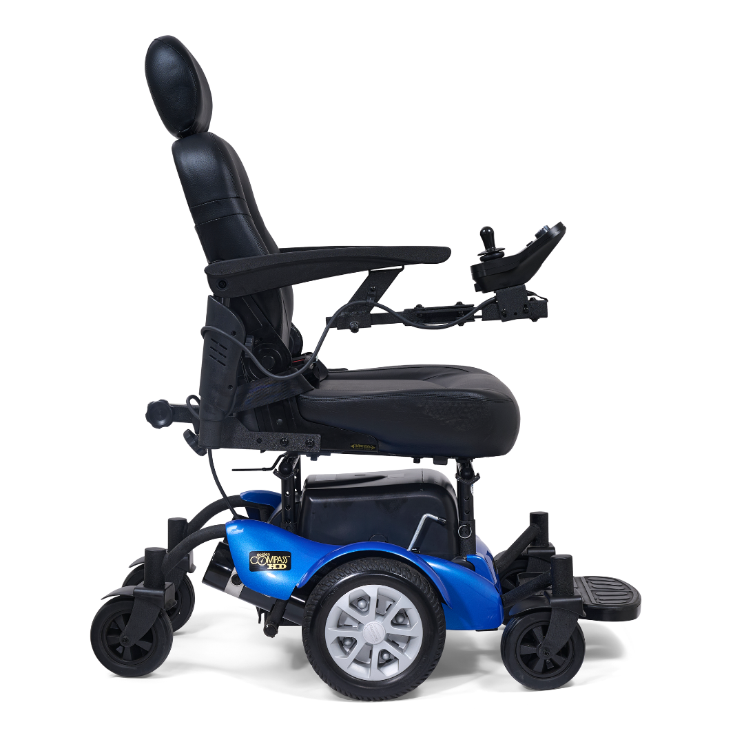 The Golden Tech GP620 Compass HD Bariatric Electric Wheelchair in blue and black features a high backrest, headrest, padded seat, armrests, right-arm joystick control, and footrest, shown from the side.