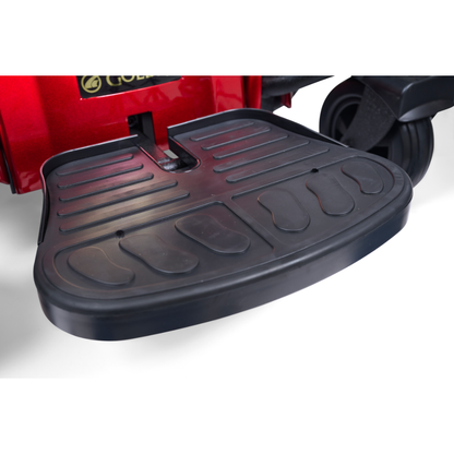Close-up of a black textured footrest on a red Golden Tech GP620 Compass HD Bariatric Electric Wheelchair, designed for user comfort and support.