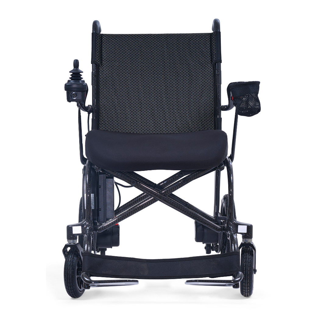 The Golden Cricket™ LT Carbon Portable Lightweight Powerchair (only 25 lbs) features a black frame, joystick armrest control, mesh seat back, cushioned seat, small front wheels, and a right-side mesh pocket—perfect for easy travel.