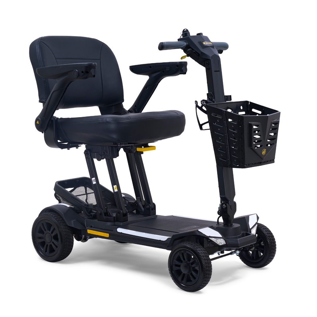 The Golden Buzzaround GB220 CarryOn HD Travel Scooter features a black design, padded seat, armrests, four wheels, front basket, and supports up to 400 lbs. This lightweight scooter includes a FREE extra battery for personal mobility assistance.