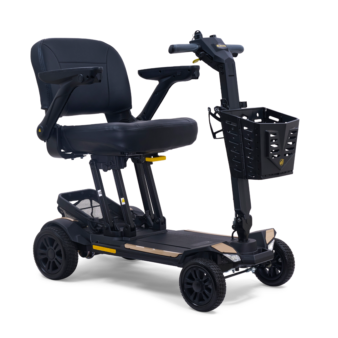The Golden Buzzaround GB220 CarryOn HD Travel Scooter with FREE Extra Battery is a black, lightweight, 4-wheel scooter featuring a padded seat, armrests, front basket, and a 400 lb weight capacity for accessible personal transportation.