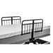 The Golden Passport Hi/Low Full Electric Homecare Bed with Massage features adjustable railings, a white patterned mattress, and a sturdy black metal frame for practical use.