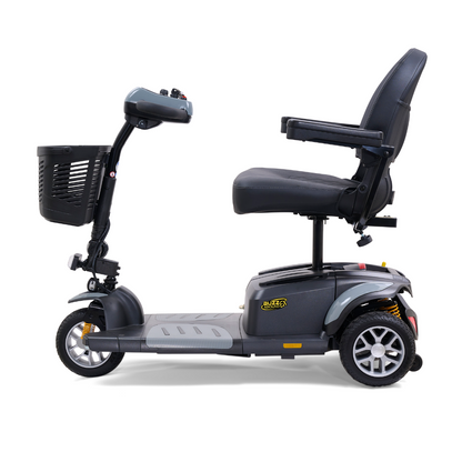 Side view of the Golden Tech GB118 Buzzaround EX Portable Mobility Scooter, featuring three wheels, a padded seat with armrests, a front basket, intuitive tiller and controls. This lightweight black scooter displays Buzz branding on the base.