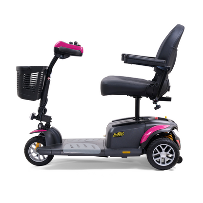 Side view of a black and pink Golden Tech GB118 Buzzaround EX 3-wheel mobility scooter featuring a cushioned seat, handlebar controls, and front basket. Its designed for personal transportation with a compact and sturdy appearance.