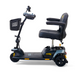 Side view of a black Golden Tech GB121 Buzzaround XLS HD scooter with cushioned seat, armrests, and a front basket. This 3-wheel model offers Comfort Spring Suspension for smooth rides, stable design, handlebar controls, and displays the brand logo on the base.