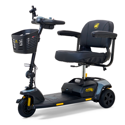 The Golden Tech GB121 Buzzaround XLS HD 3-Wheel Portable Scooter in black offers a padded seat and armrests for comfort. It features a front basket, handlebars with controls, and Comfort Spring Suspension for smooth rides. The yellow brand logo adorns both the body and seat.