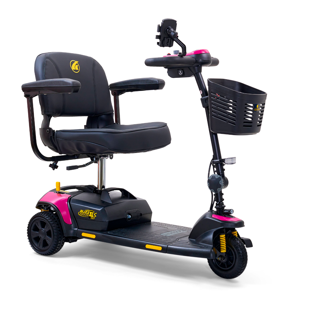 The Golden Tech GB121 Buzzaround XLS HD 3-Wheel Portable Scooter combines black and pink design, a stadium seat with armrests, handlebar controls, and a front black basket. It has Comfort Spring Suspension and supports up to 325 lb. for smooth rides and easy transport.