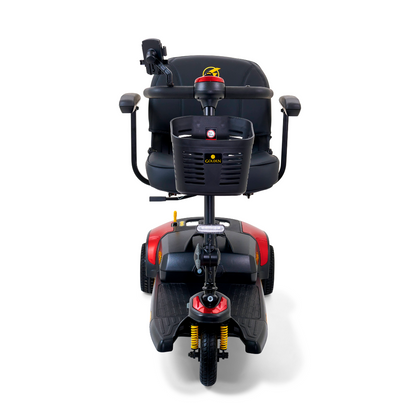 The Golden Tech GB121 Buzzaround XLS HD 3-Wheel Portable Scooter features a front view with a black design, red accents, padded seat, armrests, handlebars, and a front basket. Comfort Spring Suspension provides smooth rides while the Delta tiller allows easy control for effortless maneuvering.
