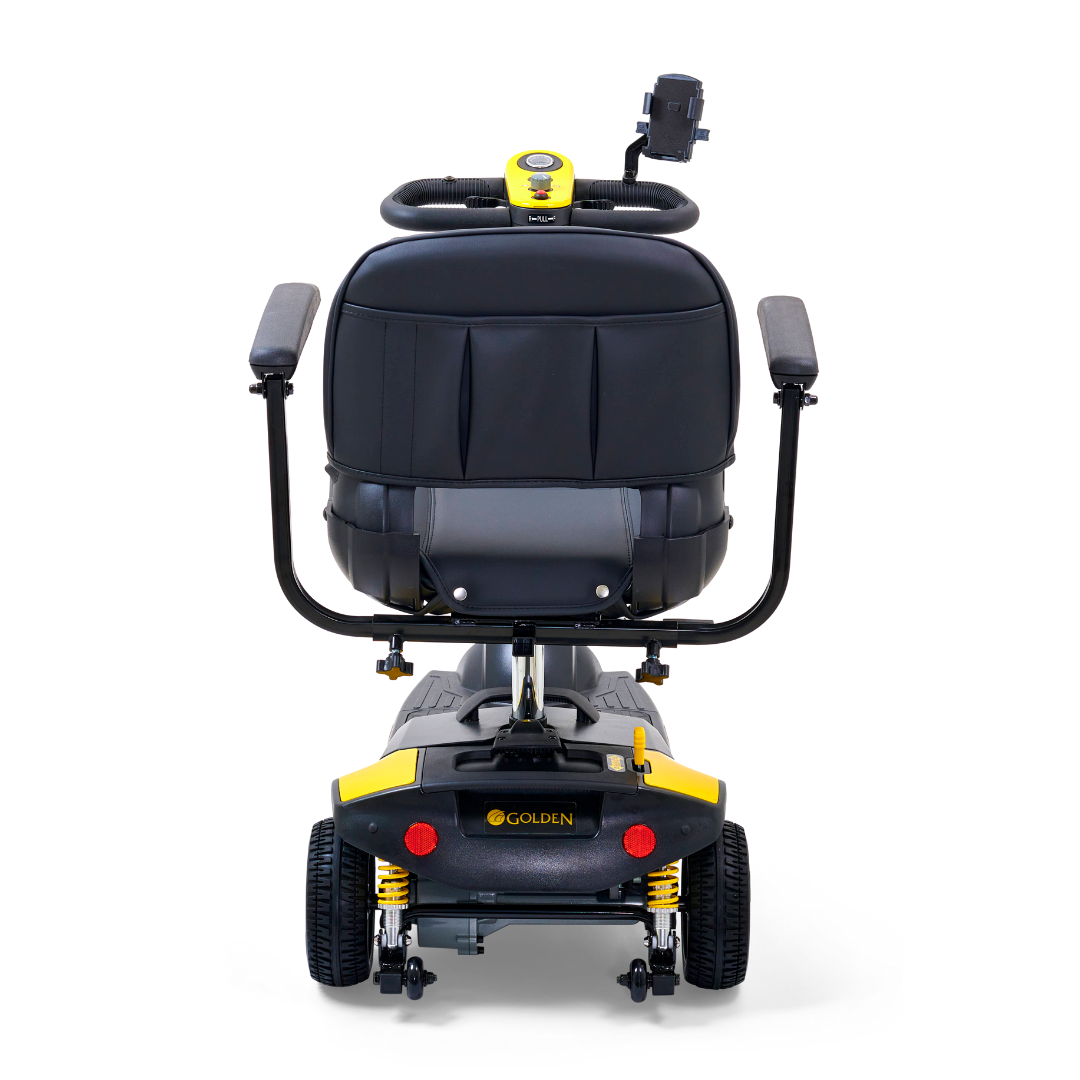The Buzzaround XLS HD 3-Wheel Portable Scooter features a black seat, adjustable padded armrests, yellow and black detailing, an XR Extended Range Battery, and a rear view with a control panel on the backrest for easy operation.