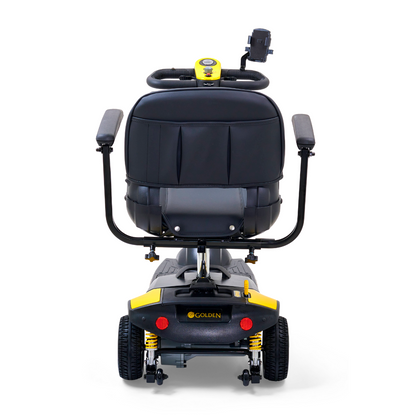 The Buzzaround XLS HD 3-Wheel Portable Scooter features a black seat, adjustable padded armrests, yellow and black detailing, an XR Extended Range Battery, and a rear view with a control panel on the backrest for easy operation.