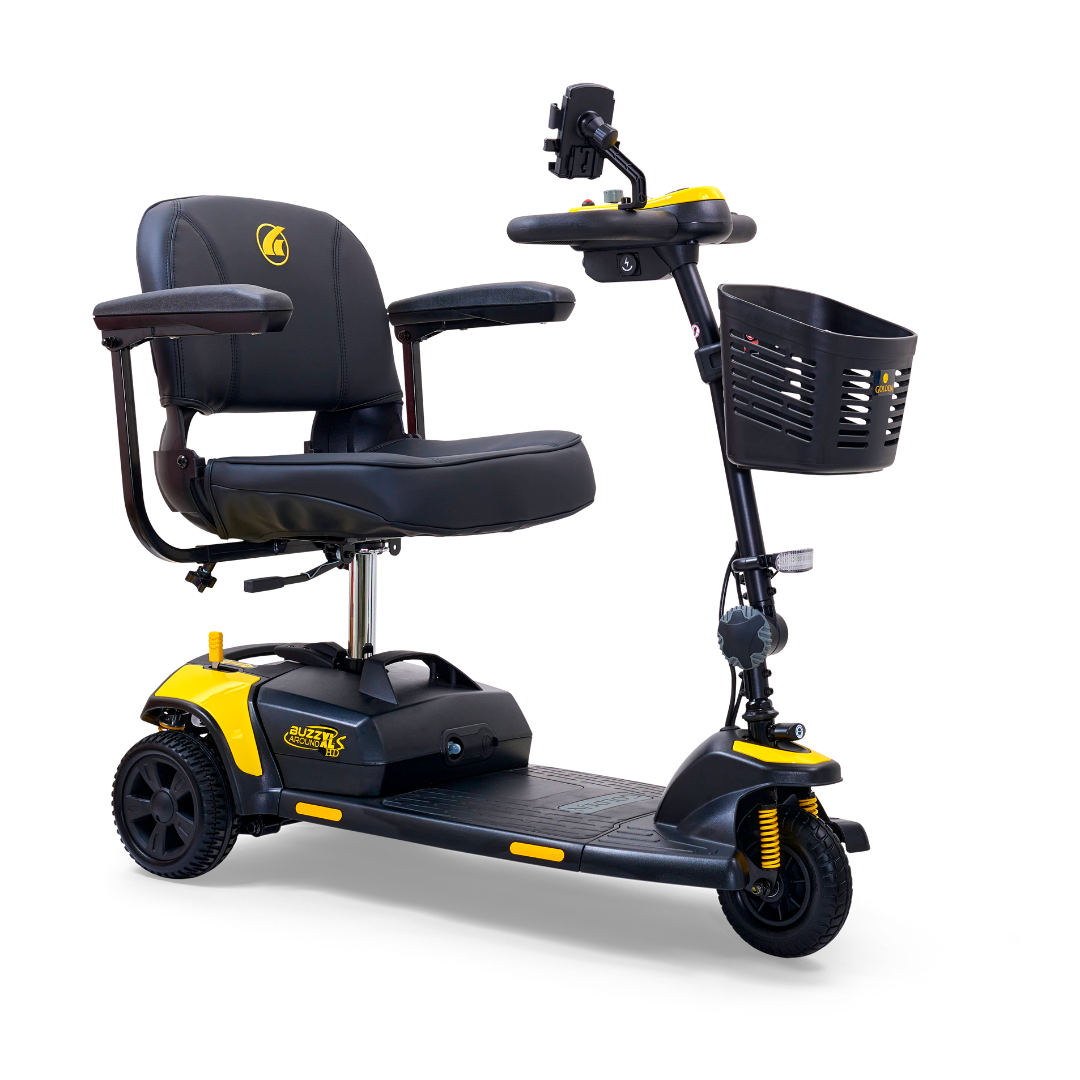 The Golden Tech GB121 Buzzaround XLS HD is a 3-wheel portable scooter with a comfortable black seat, armrests, handlebar controls, and a front basket. It features yellow accents and Comfort Spring Suspension for smooth rides, making it ideal for personal transportation.