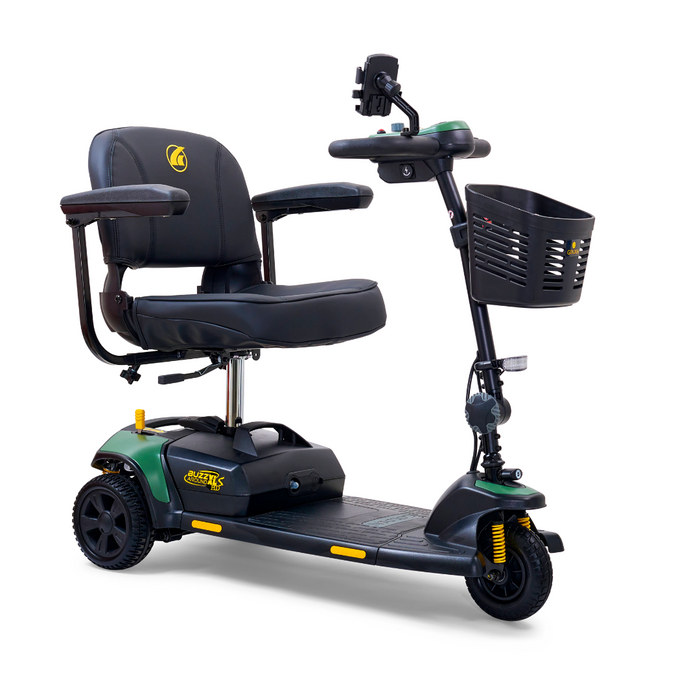 The Golden Tech GB121 Buzzaround XLS HD is a compact black and green 3-wheel scooter featuring a delta tiller, padded seat with armrests, front basket, small headlight, and footrest area; the XR Extended Range Battery offers longer rides.