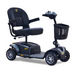 The Golden Tech GB148 Buzzaround EX is a black, four-wheel mobility scooter featuring a comfortable seat with armrests, intuitive handlebar controls, a front basket, and a sturdy footrest platform. Its the perfect lightweight scooter for daily use.