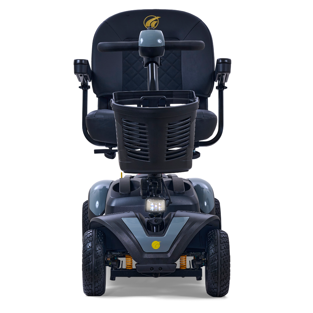 Front view of a black Golden Tech GB148 Buzzaround EX Portable Mobility Scooter, featuring four wheels, cushioned seat, steering handle, small front basket, base light, and yellow spring elements for suspension, ensuring practicality and comfort in this full-size scooter.