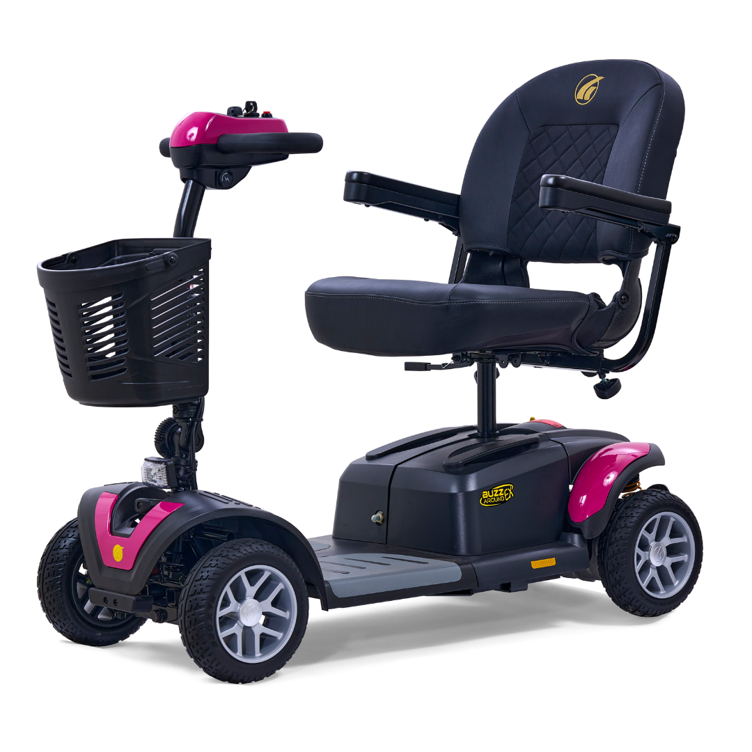 The Golden Tech GB148 Buzzaround EX is a sleek, portable mobility scooter featuring pink and black styling. It includes a padded seat with armrests, four sturdy wheels, front basket, and handlebar controls—offering both functionality and style for personal mobility assistance.