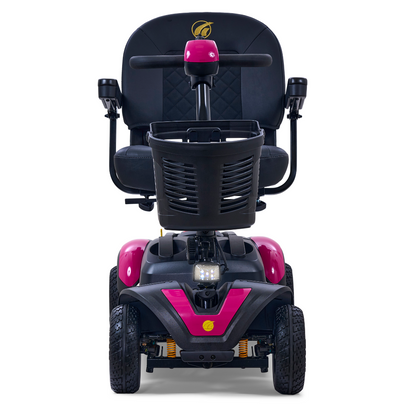 The Golden Tech GB148 Buzzaround EX Portable Mobility Scooter, shown in pink and black from the front, features a padded seat with armrests, a basket on the handlebars, and four sturdy wheels, combining style and comfort for your mobility needs.