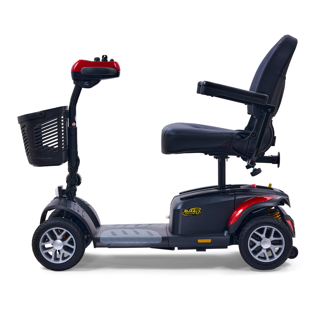 A side view of the Golden Tech GB148 Buzzaround EX, a black and red four-wheel mobility scooter with a front basket and padded seat featuring armrests. This lightweight, full-size personal transport solution is set against a plain white background.
