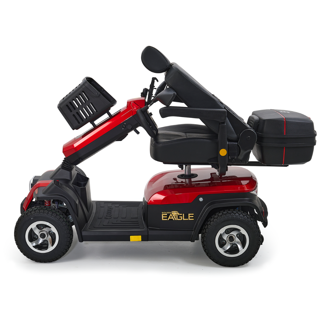 The vibrant red Golden Tech Eagle HD Bariatric 4-Wheel Scooter with Suspension offers off-road performance and a sleek design. Side view: four wheels, black seat with headrest, handlebars, and rear storage. Black and silver accents enhance its adventurous look.