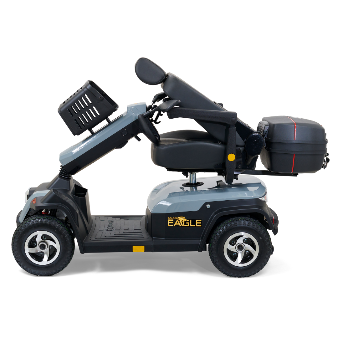A side view of the blue Golden Tech Eagle HD Bariatric 4-Wheel Scooter shows its ready for outdoor adventure, featuring a padded seat, a backrest, and a black rear carrying case. EAGLE is printed on the side. Designed with handlebars and suspension for off-road performance.