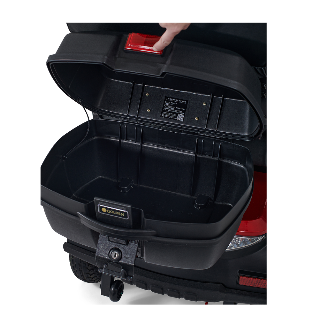 A sleek black storage box adorns the Golden Tech Eagle HD Bariatric 4-Wheel Scooter with Suspension, echoing a Golden Eagles design. Pressing the red button reveals its spacious interior, while a robust rear lock ensures secure off-road travel.