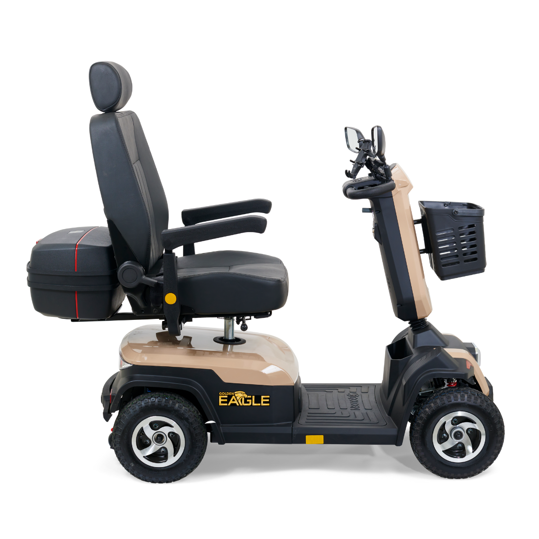 Side view of the Golden Tech Eagle HD Bariatric 4-Wheel Scooter featuring beige and black design, cushioned seat with armrests and headrest, a small front basket, rearview mirrors, and four wheels for enhanced mobility and off-road performance.