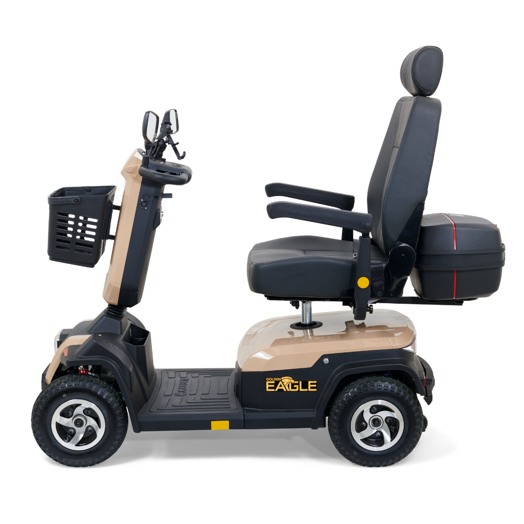 Introducing the Golden Tech Eagle HD Bariatric 4-Wheel Scooter, ideal for outdoor adventures with its beige/black design. It features a cushioned seat with armrests, rear storage, and control handlebars. Its sturdy four-wheel setup ensures superior off-road performance.